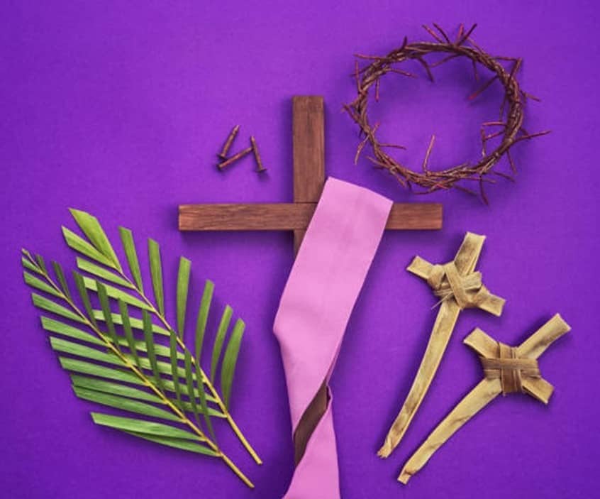 St. John's United Church | A cross, palm leaves and a crucifix on a purple background.
